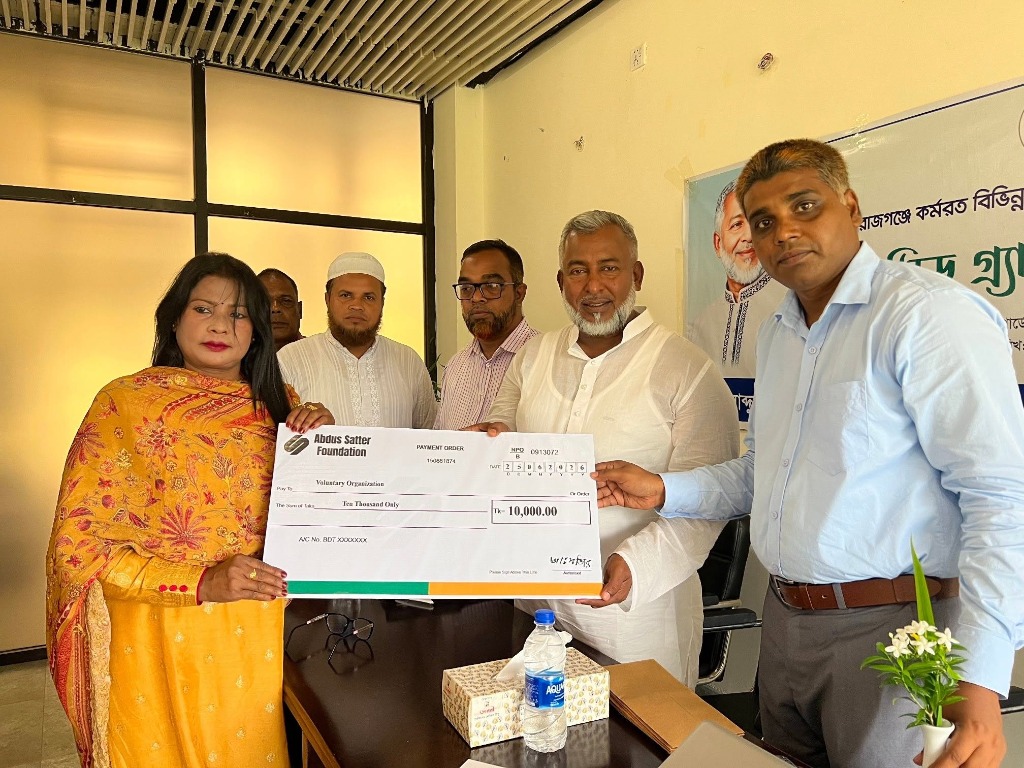 Chairman distributing food relief to elderly man